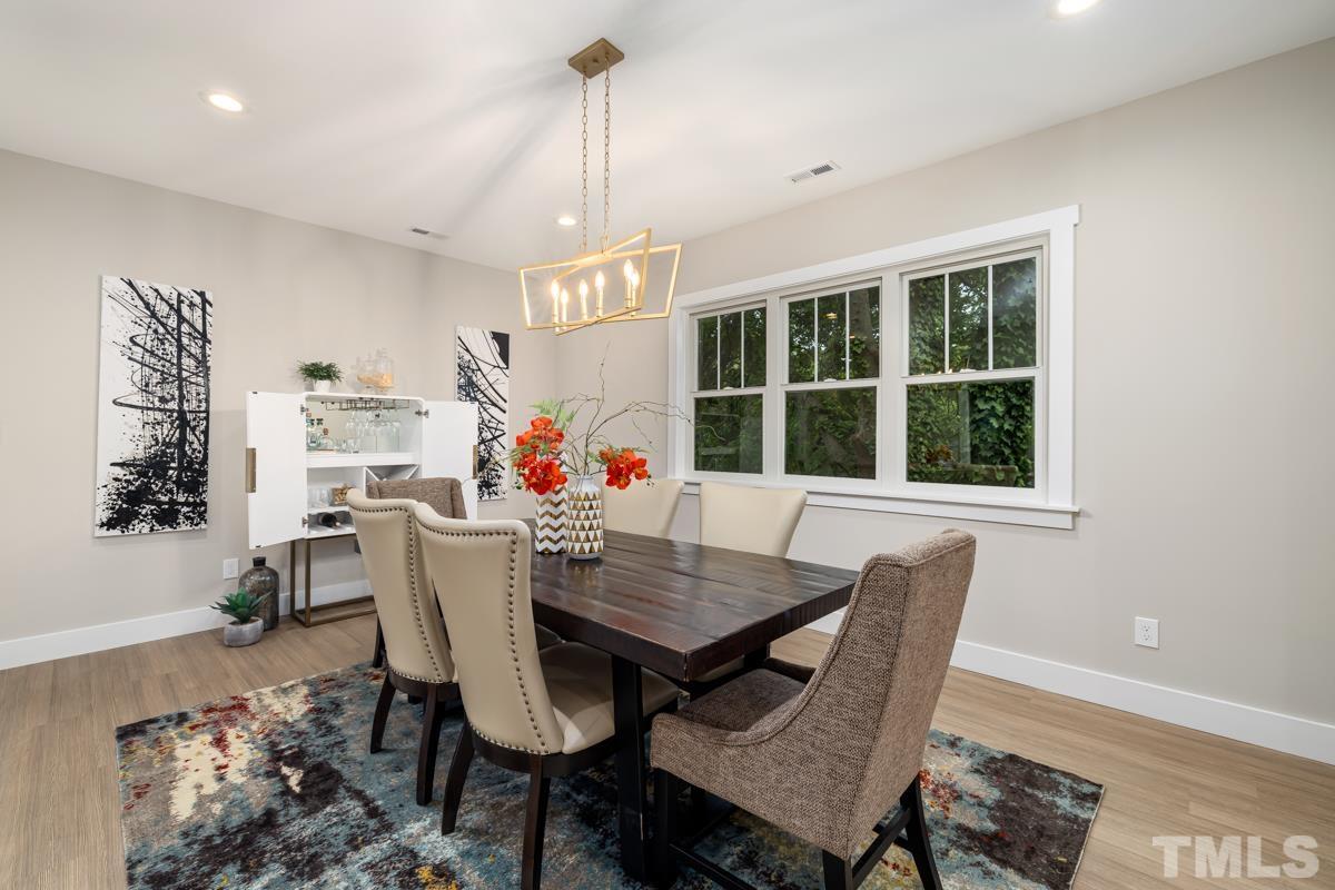 725 Church Street Raleigh, NC 27601 - Photo 8 of 21 a view of a dining room with furniture window and outside view