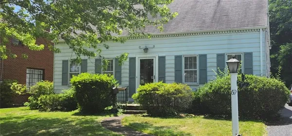 front view of a house with a yard