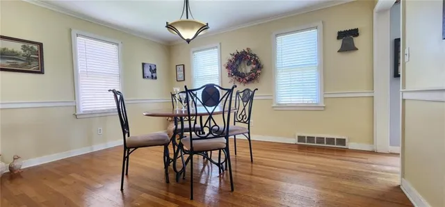 a living room with furniture rug and window