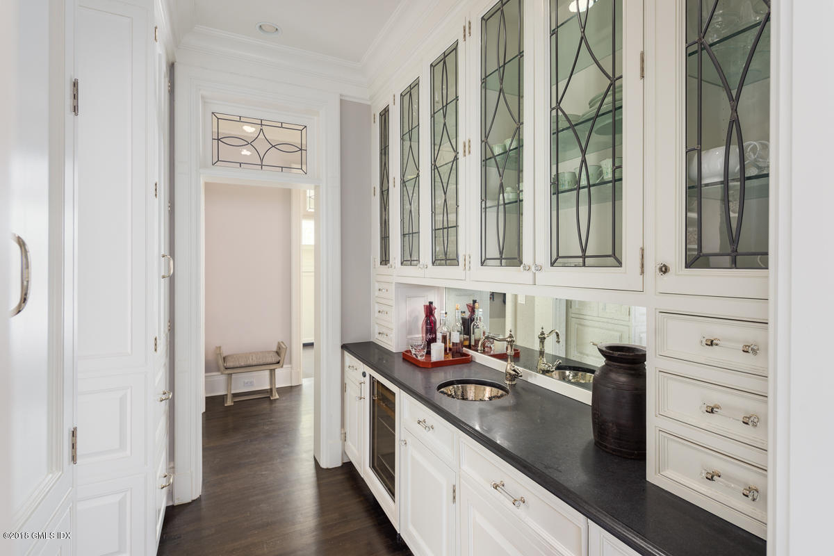 30 Club Road Riverside, CT 06878 - Photo 15 of 53 a kitchen with granite countertop a sink and a stove next to a window