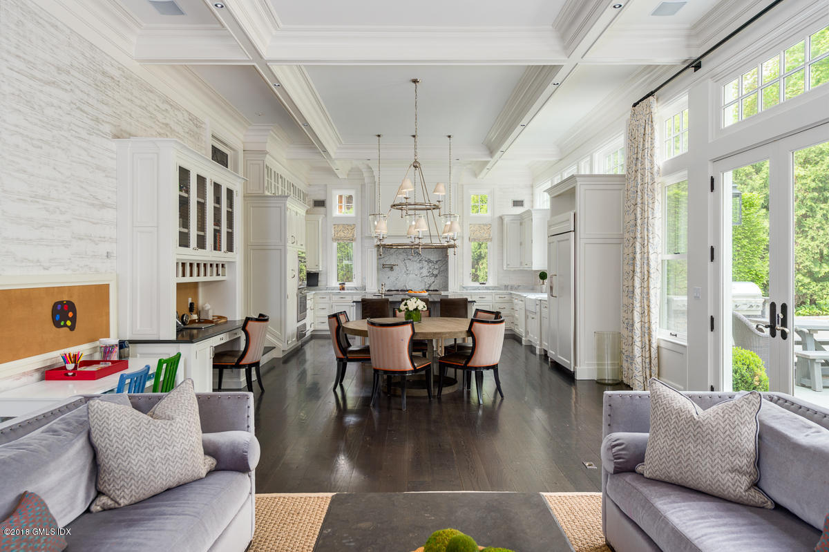 30 Club Road Riverside, CT 06878 - Photo 25 of 53 a dining room with wooden floor furniture and a chandelier