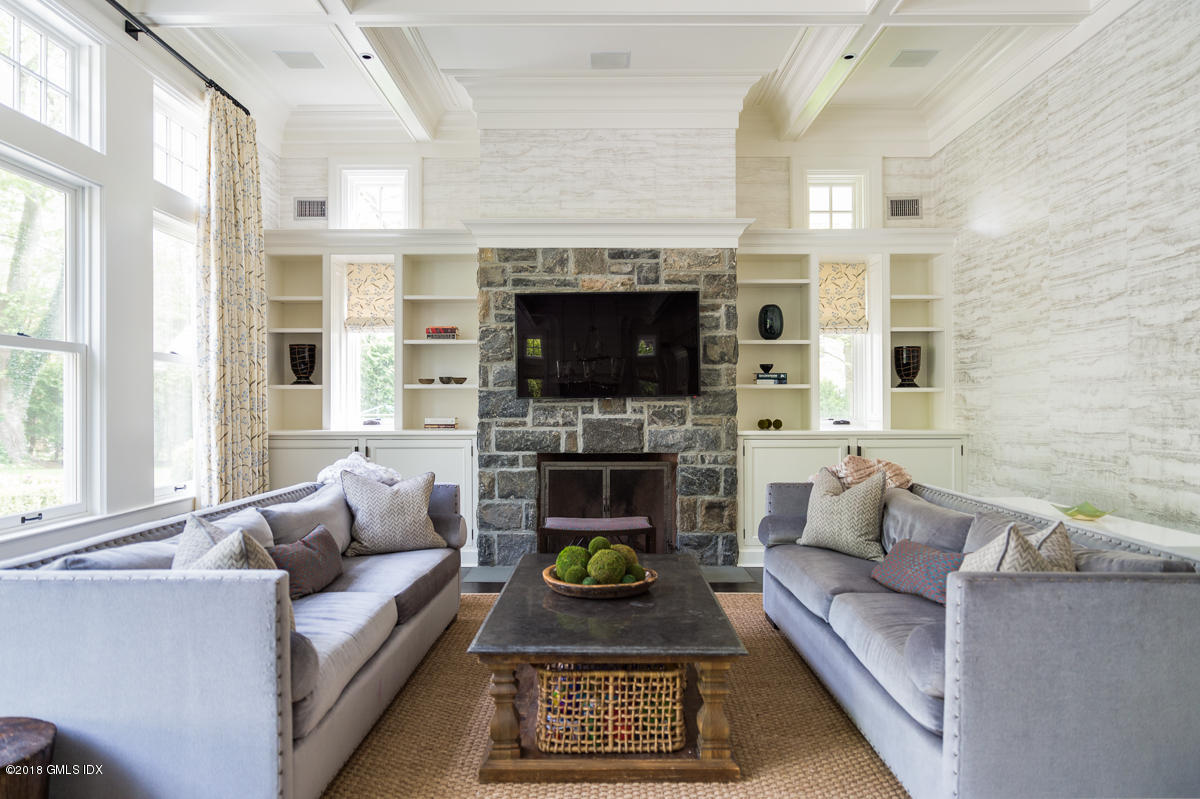 30 Club Road Riverside, CT 06878 - Photo 26 of 53 a living room with furniture a rug and a fireplace