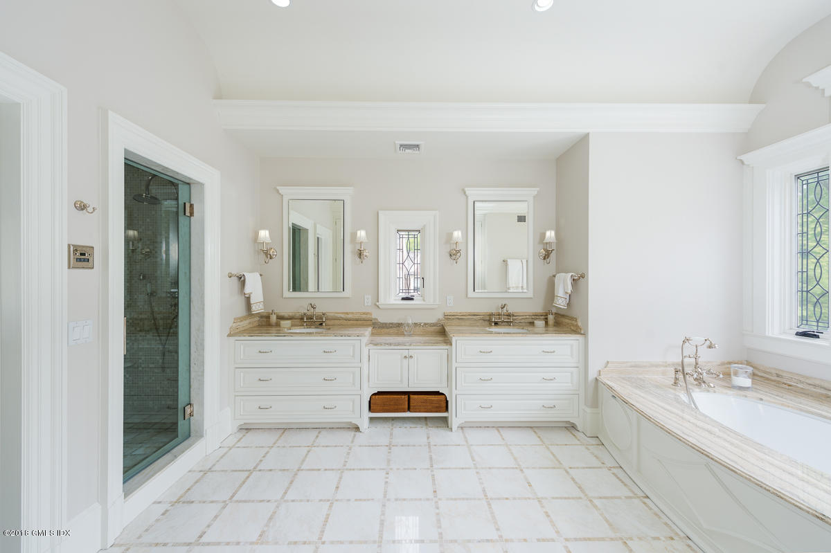 30 Club Road Riverside, CT 06878 - Photo 30 of 53 a large white bathroom with a granite countertop sink mirror and bathtub