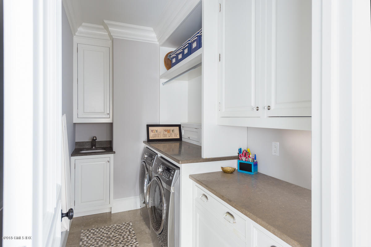 30 Club Road Riverside, CT 06878 - Photo 33 of 53 a kitchen with refrigerator and cabinets