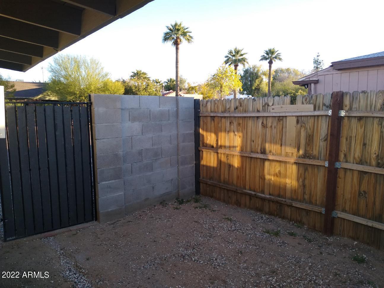 1629 East Pinchot Avenue Phoenix, AZ 85016 - Photo 4 of 9 a view of a wrought fence