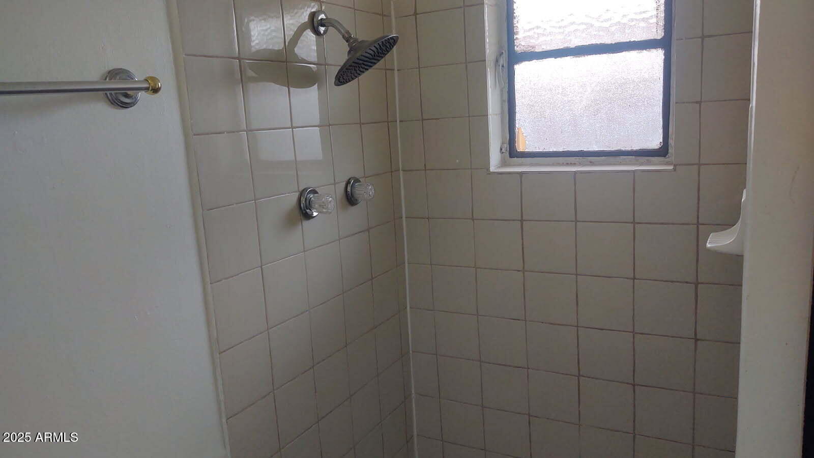 1629 East Pinchot Avenue Phoenix, AZ 85016 - Photo 6 of 9 a bathroom with a shower and window