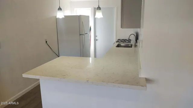 a bathroom with a sink and mirror