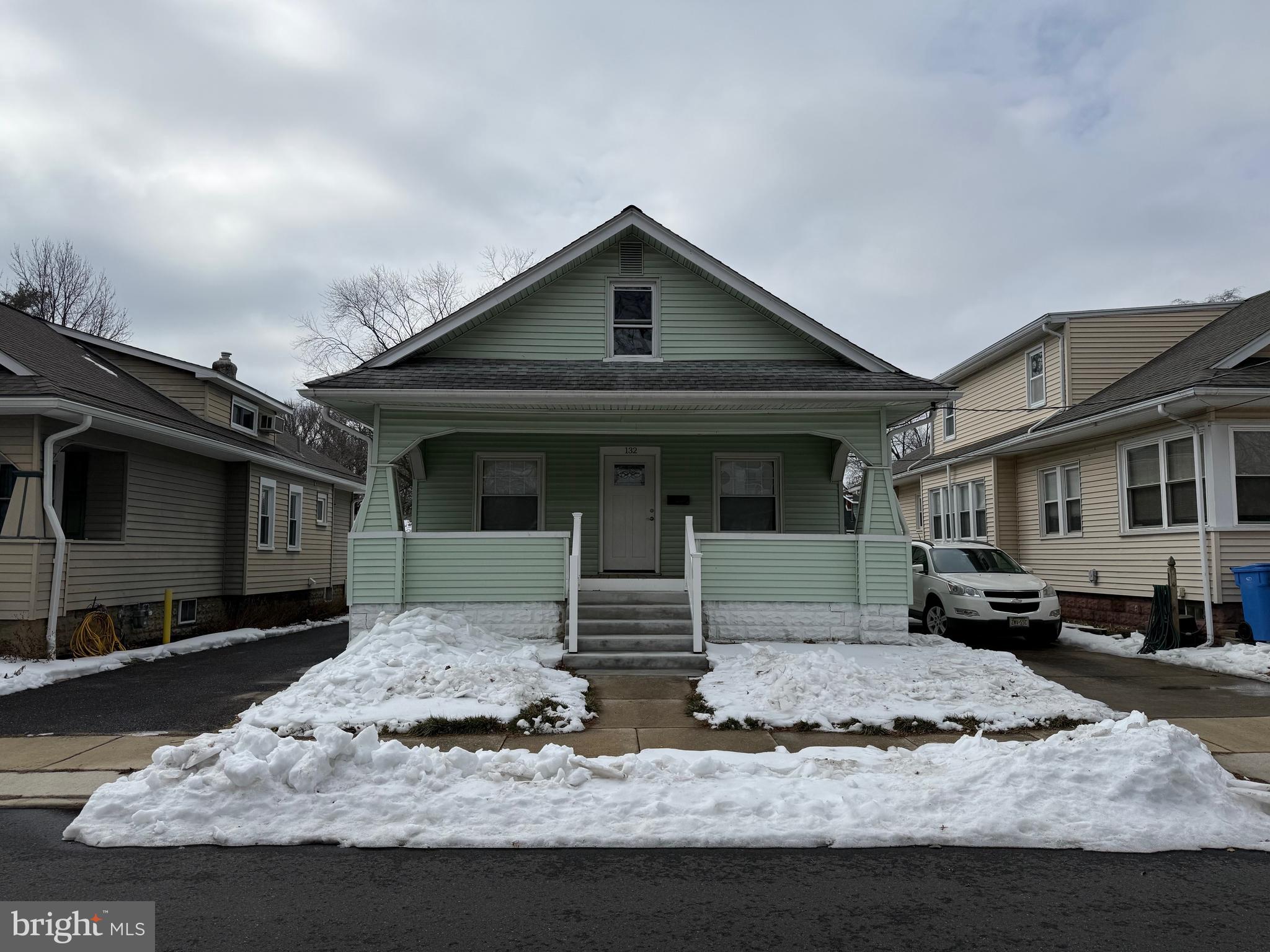 132 Walnut Street Westville, NJ 08093 - Photo 2 of 23 a front view of a house with garden