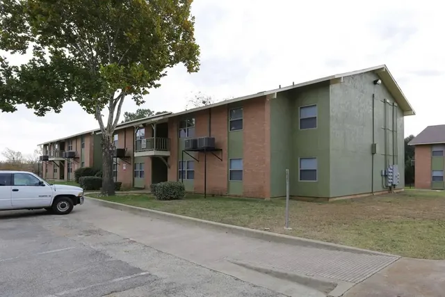 a view of a car park in front of house