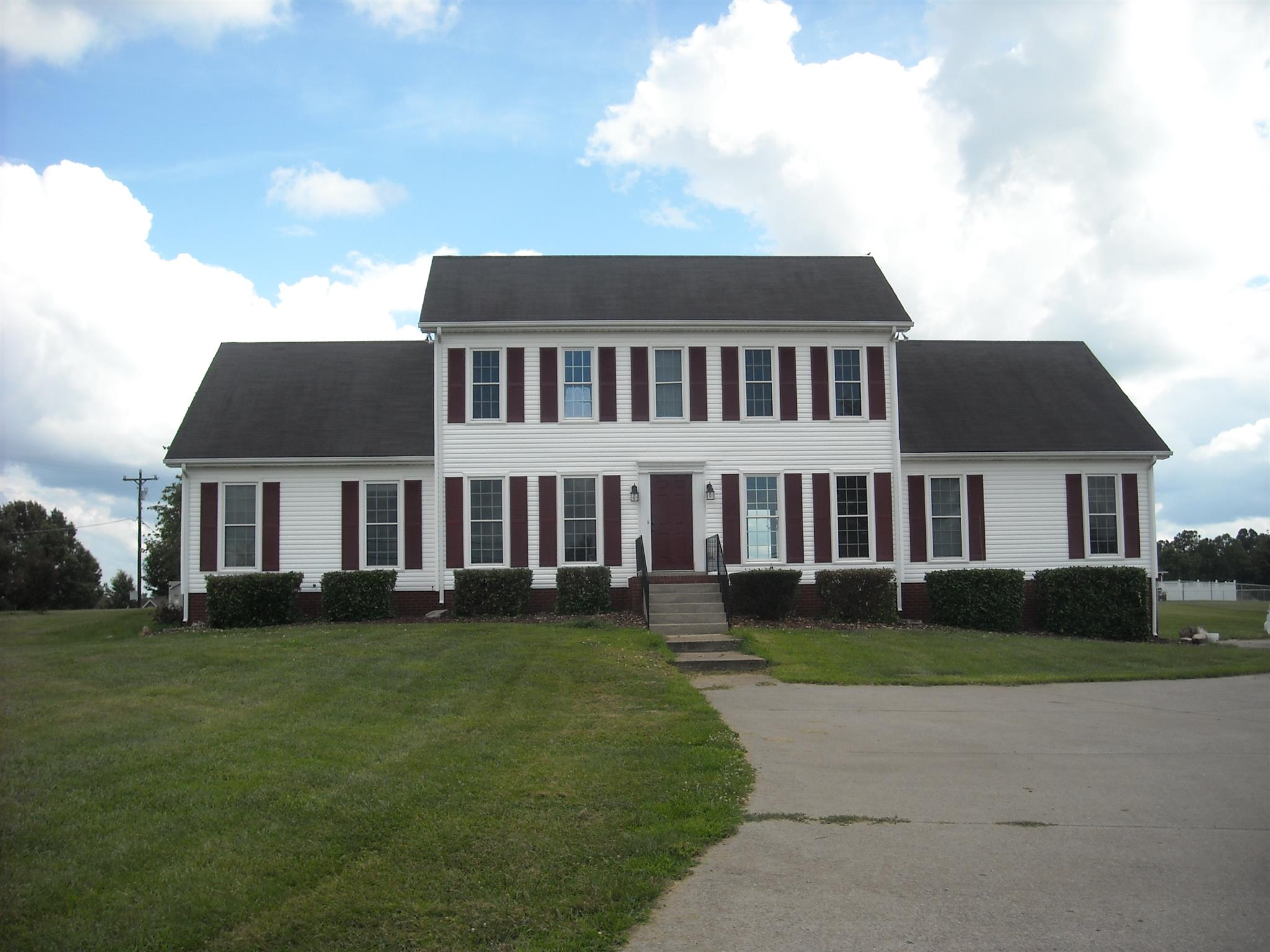 2498 Pleasant View Road Pleasant View, TN 37146 - Photo 1 of 14 a front view of a house with a garden