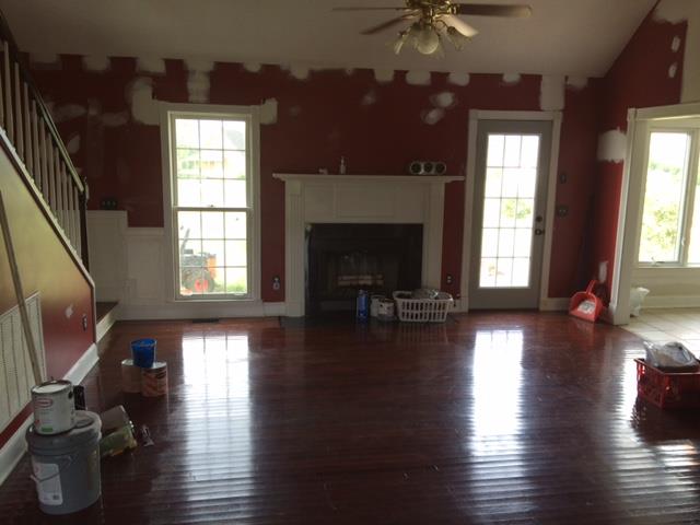 2498 Pleasant View Road Pleasant View, TN 37146 - Photo 3 of 14 a view of a livingroom with furniture hardwood floor and a fireplace