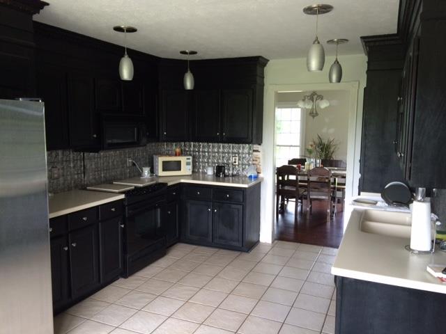 2498 Pleasant View Road Pleasant View, TN 37146 - Photo 5 of 14 a kitchen with a sink and cabinets