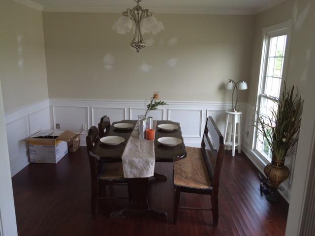 2498 Pleasant View Road Pleasant View, TN 37146 - Photo 8 of 14 a view of a dining room with furniture and wooden floor
