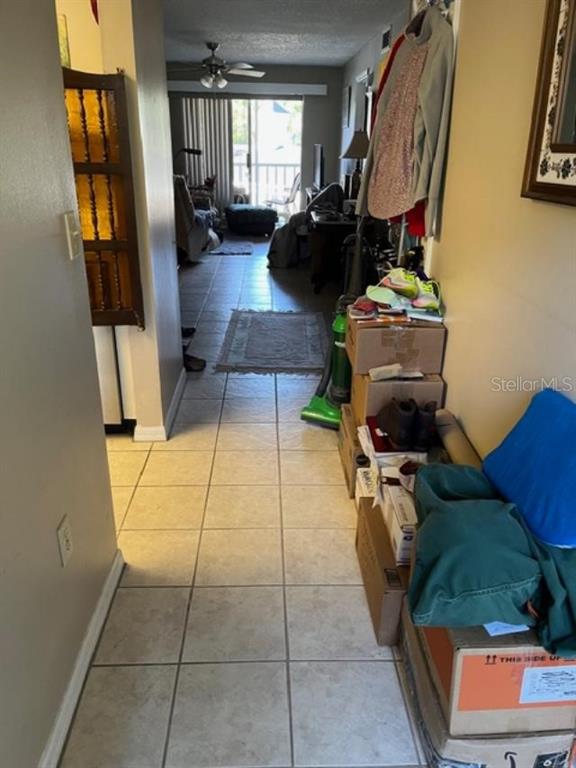 330 Promenade Drive, Unit 206 Dunedin, FL 34698 - Photo 13 of 31 a living room with patio furniture