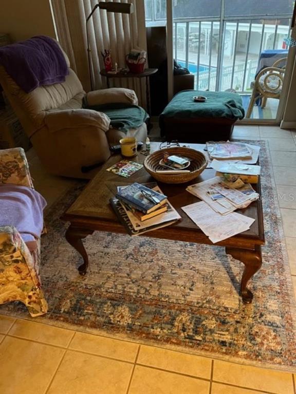 330 Promenade Drive, Unit 206 Dunedin, FL 34698 - Photo 15 of 31 a living room with furniture and a window