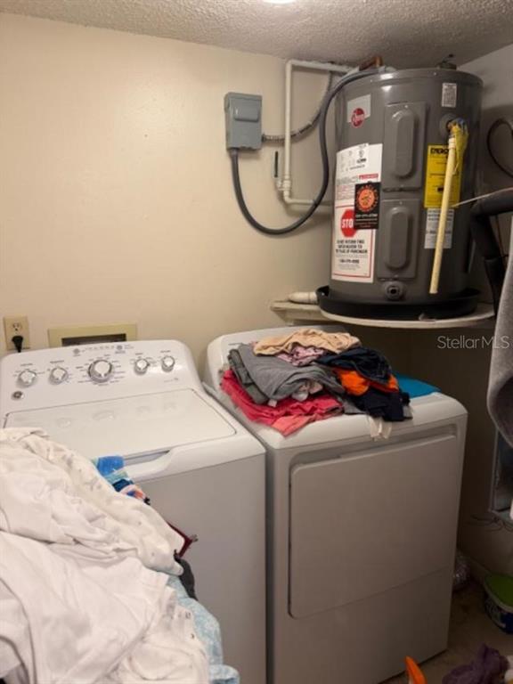 330 Promenade Drive, Unit 206 Dunedin, FL 34698 - Photo 23 of 31 a utility room with dryer and washer