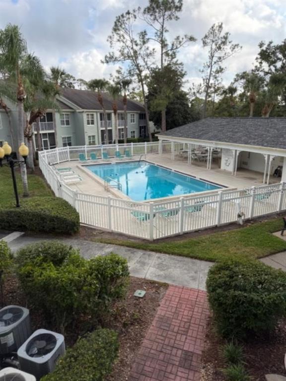 330 Promenade Drive, Unit 206 Dunedin, FL 34698 - Photo 8 of 31 a view of a house with backyard and sitting area
