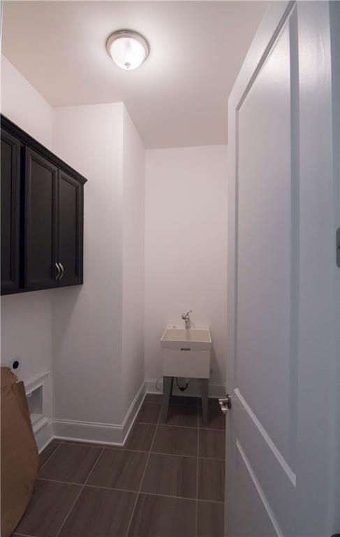 5865 Overlook Ridge East, Unit 105 Suwanee, GA 30024 - Photo 12 of 40 Family room with built in bookcases