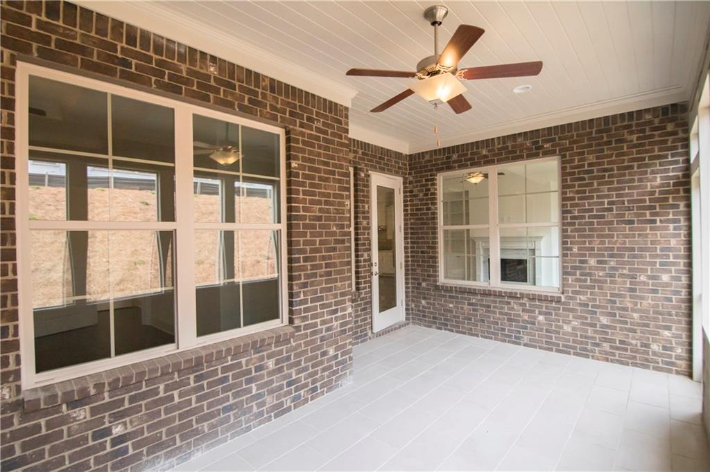 5865 Overlook Ridge East, Unit 105 Suwanee, GA 30024 - Photo 26 of 40 1 of 2 unfinished storage rooms upstairs
