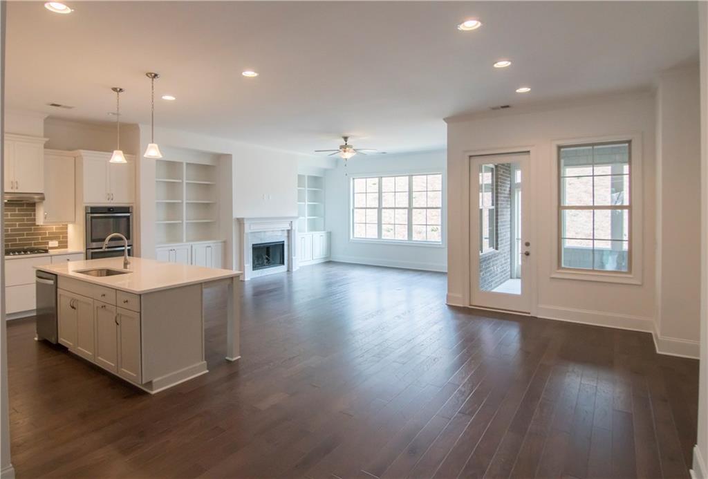 5865 Overlook Ridge East, Unit 105 Suwanee, GA 30024 - Photo 4 of 40 Picture is representative. This is photo of Avery Plan decorated model kitchen