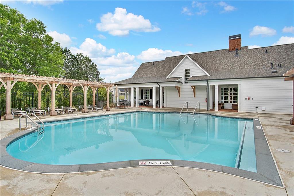 5865 Overlook Ridge East, Unit 105 Suwanee, GA 30024 - Photo 33 of 40 Picture of pool is representative. Clubhouse and pool under construction.