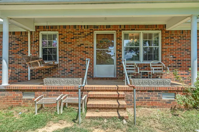 a front view of a house with a porch