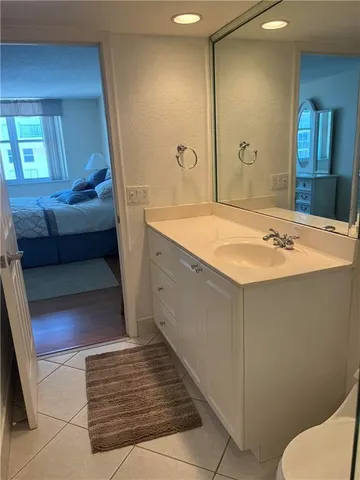 a bathroom with a sink and mirror