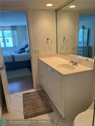 a bathroom with a sink and mirror