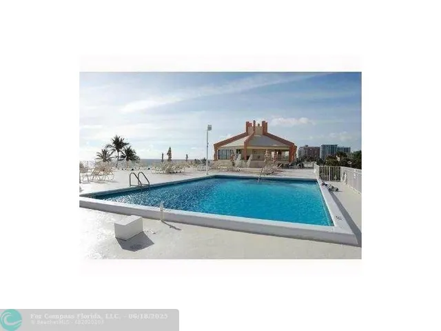 a picture of a living room with a sink