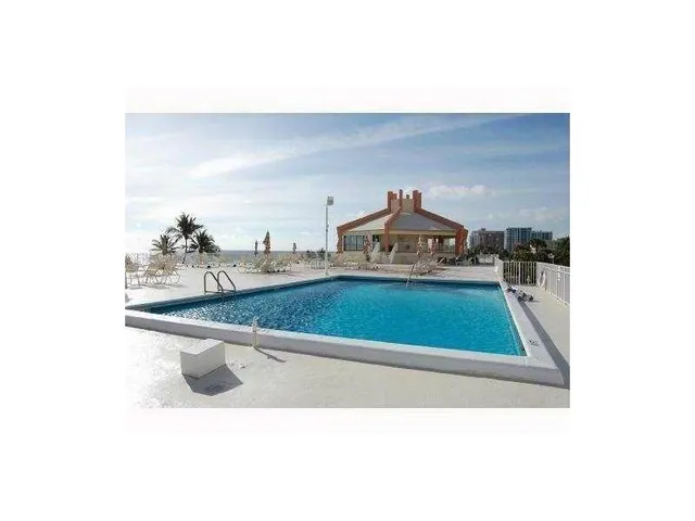 a picture of a living room with a sink