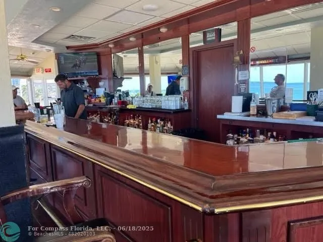 a kitchen with stainless steel appliances kitchen island granite countertop a sink and cabinets