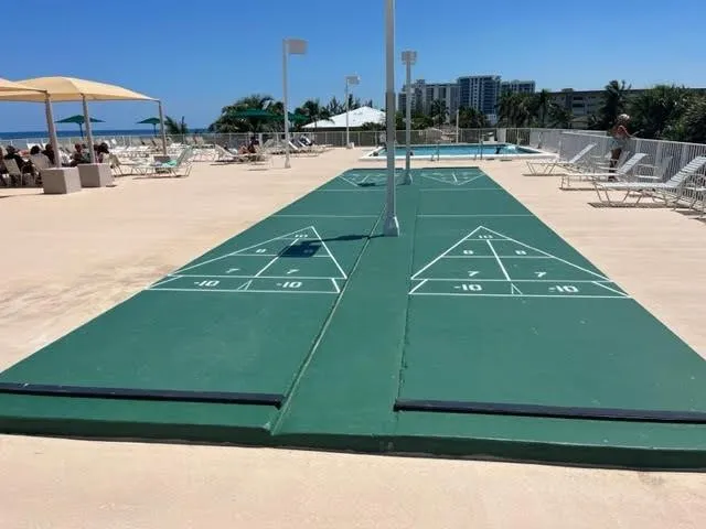 a view of swimming pool with outdoor seating and yard
