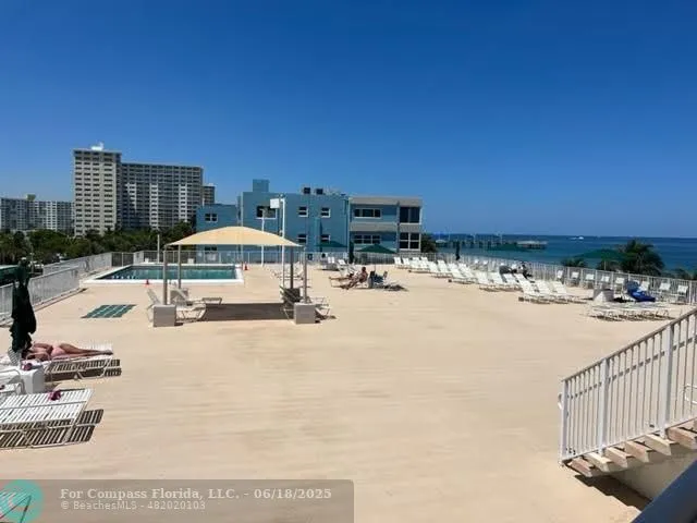 a view of a swimming pool and an outdoor space