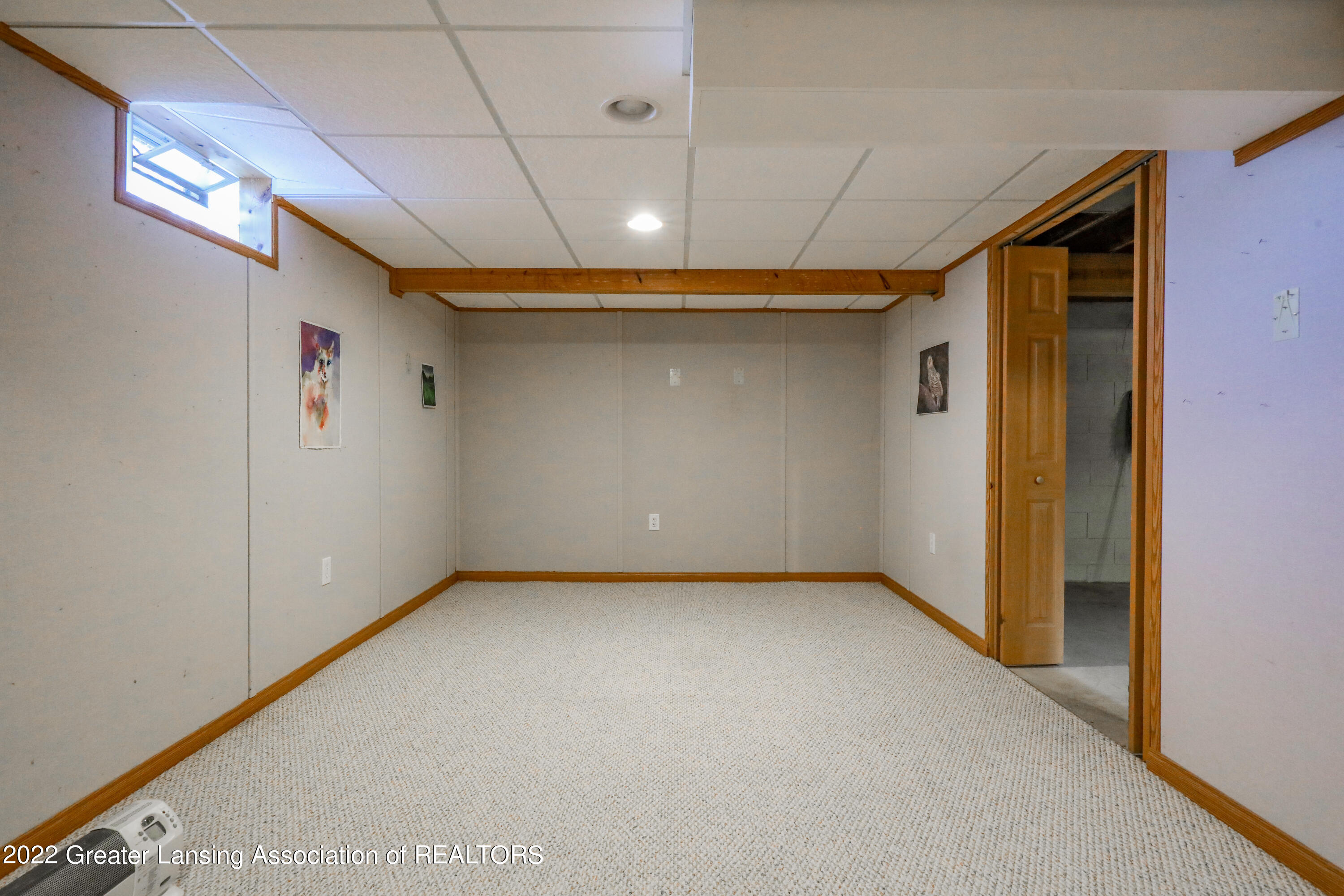 6002 Rockingham Drive Lansing, MI 48911 - Photo 17 of 26 Lower level music room