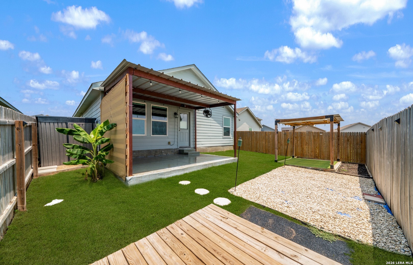 6566 Runaway Row Converse, TX 78109 - Photo 26 of 27 a backyard of a house with table and chairs