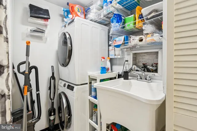 a utility room with multiple dryer and washer
