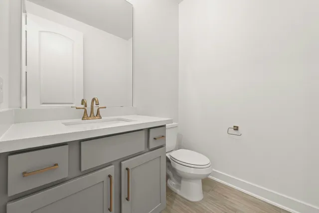 an empty room with windows and cabinet