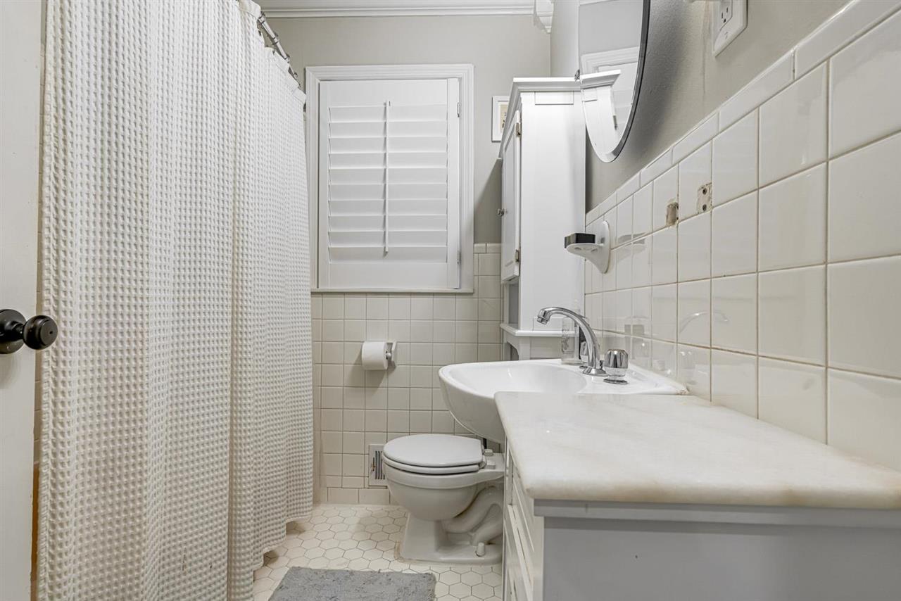 80 East Carlos Road Memphis, TN 38117 - Photo 19 of 25 a bathroom with a sink a toilet and shower curtain