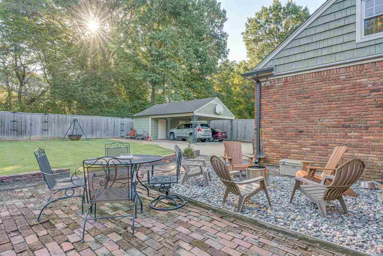 80 East Carlos Road Memphis, TN 38117 - Photo 22 of 25 a view of house with backyard outdoor seating area