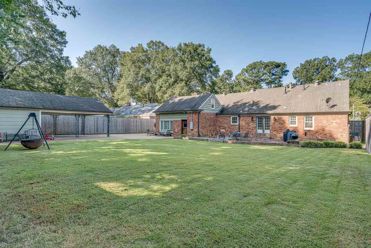80 East Carlos Road Memphis, TN 38117 - Photo 24 of 25 a view of a house with a backyard and a patio