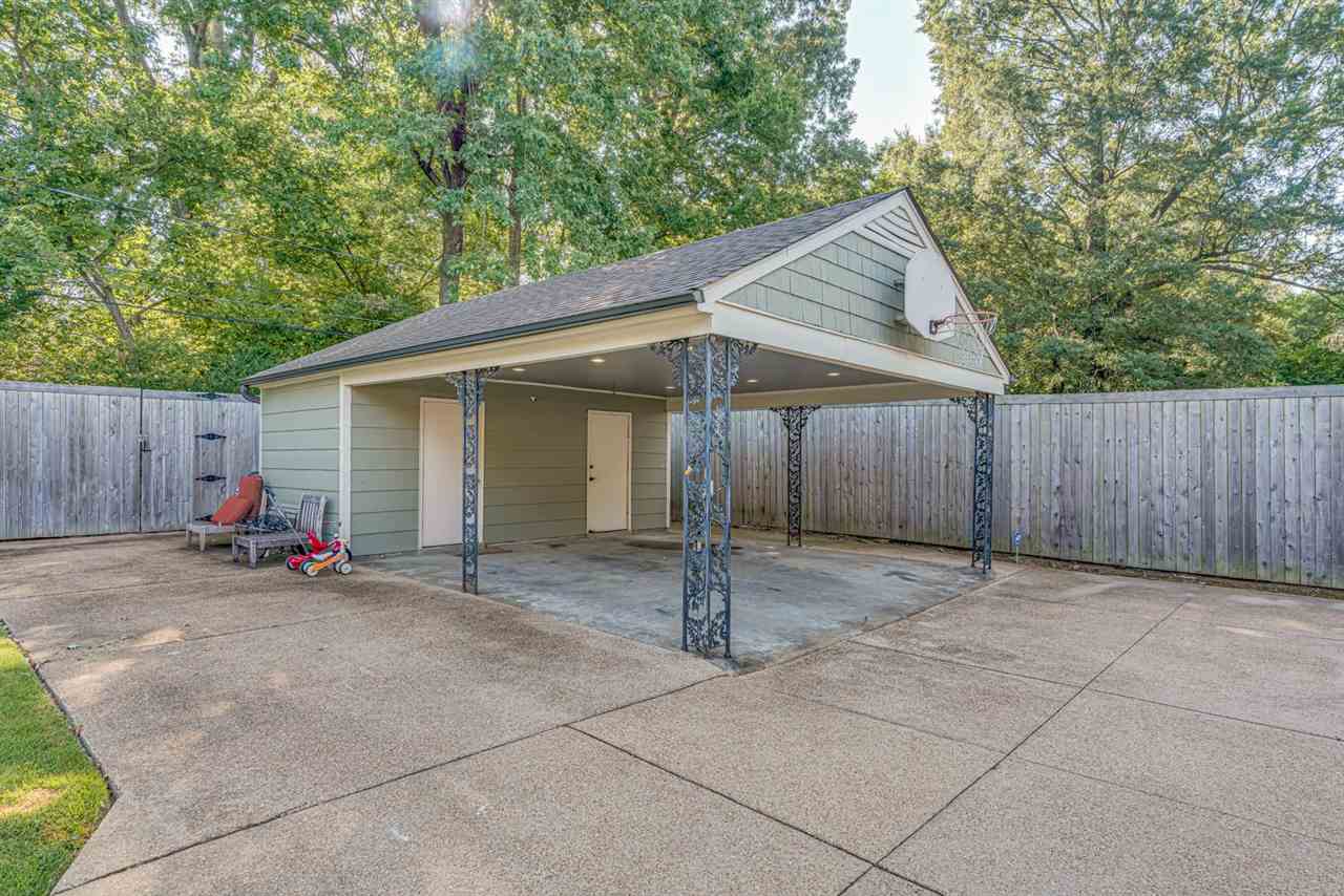 80 East Carlos Road Memphis, TN 38117 - Photo 25 of 25 a view of a house with a patio and backyard