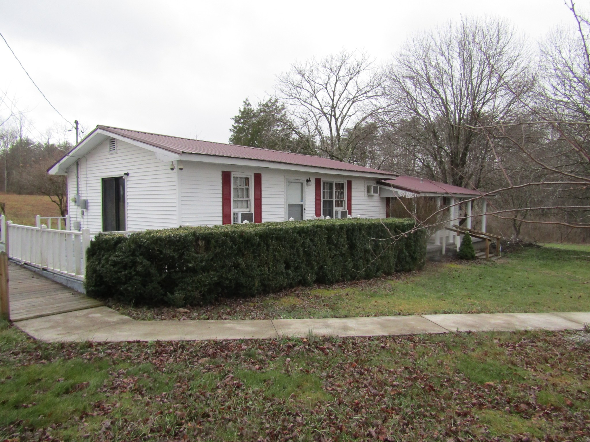 171 Sheep Ranch Road Altamont, TN 37301 - Photo 29 of 48 a front view of a house with a yard and garage