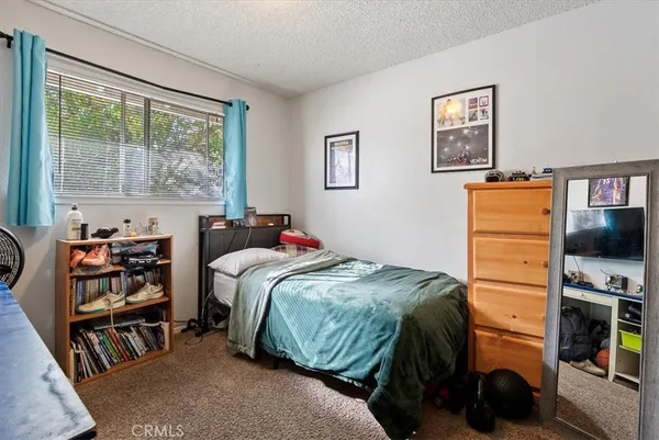 a view of a dining room with furniture wooden floor and chandelier