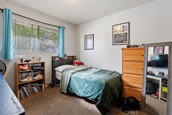 a kitchen with a white stove top oven and white cabinets
