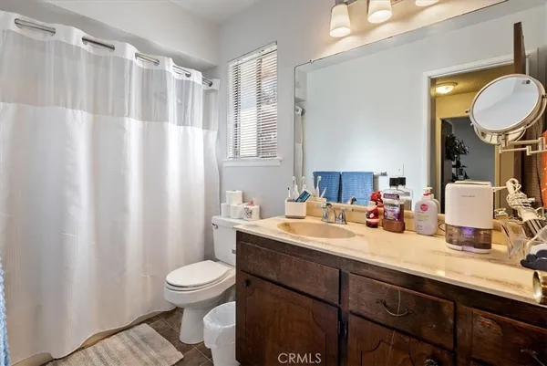 a kitchen with cabinets appliances a sink and a window
