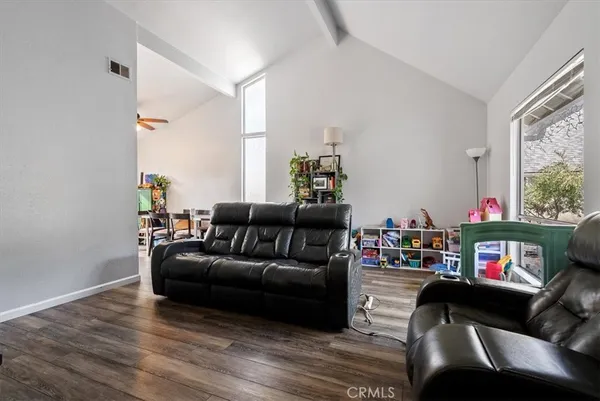 a bedroom with a bed and flat screen tv