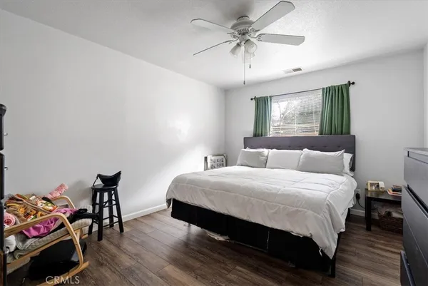a living room with furniture and a book shelf