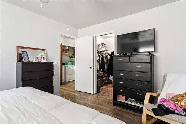 a living room with furniture a rug and a window