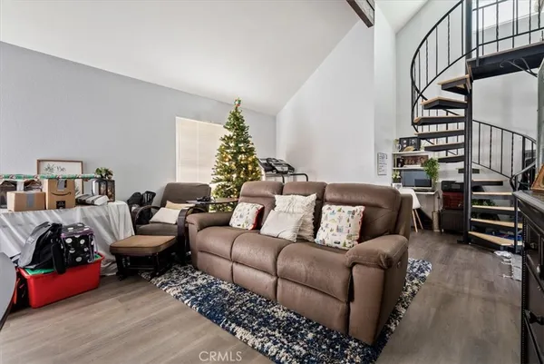 a view of a dining room with furniture and a large window