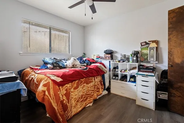 a kitchen with granite countertop white cabinets sink and stainless steel appliances